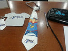 Corbatas sublimables personalizadas con distintos diseños sobre una mesa