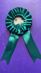 Roseta verde oscuro con cintas para medalla o reconocimiento